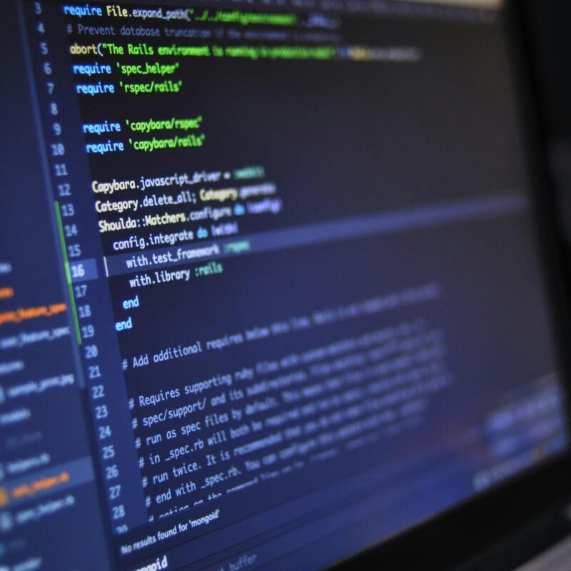 close-up of a laptop screen with code, representing a technical SEO audit