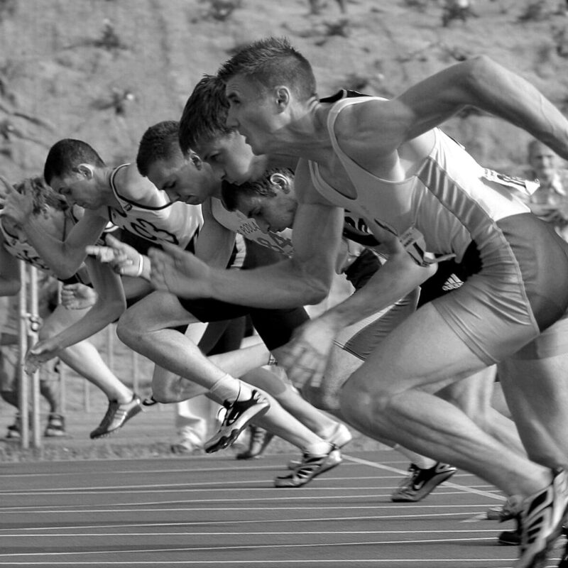 group of men running a marathon